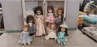 (7) Assorted Vintage Dolls & (1) Metal Doll Case