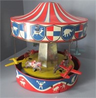Wolverine tin Merry Go Round. Measures: 12" Tall.