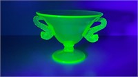 Uranium glass compote with dolphin handles.