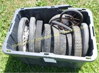 BIN OF MOWER WHEELS AND TIRES