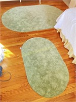 Pair of oval textured rugs