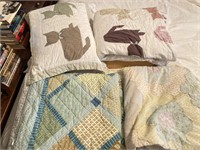 Assortment of bedding and pillows