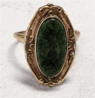MARKED 10K RING WITH GREEN STONE