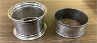 Two sterling silver napkin rings, one clearly