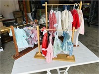 3 racks of doll clothes