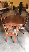 Mahogany dining table with six chairs, claw feet,