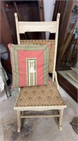 Antique wood rocking chair with tapestry