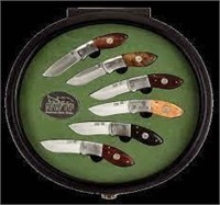 Brown Round Display Case with Six Knives