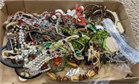 Box tray lot of costume and vintage jewelry.