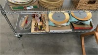 Shelf lot of chargers, fan and glassware