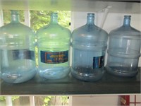 four empty water bottles
