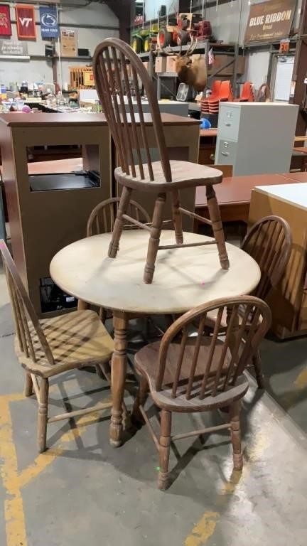 Wooden table with five chairs