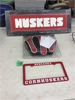 husker wood sign, golf club covers, license plate