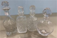 Four Pressed Glass Decanters