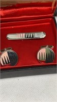 Matching design set of tie clip and cuff links