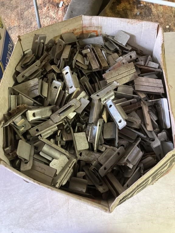 Box of metal pieces for naming cabinet drawers