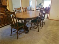 Dark stained oak dining table with 6 chairs