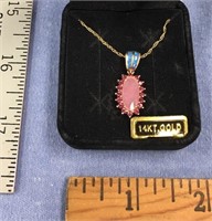 Rose quartz pendant, in 14kt gold setting on gold