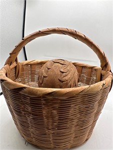 Basket with carved wooden spheres