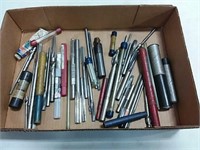 assortment of reamers and end mills
