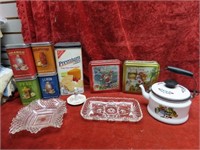 Enamel teapot, tin canisters, glass trays.