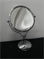 Double sided magnifying mirror