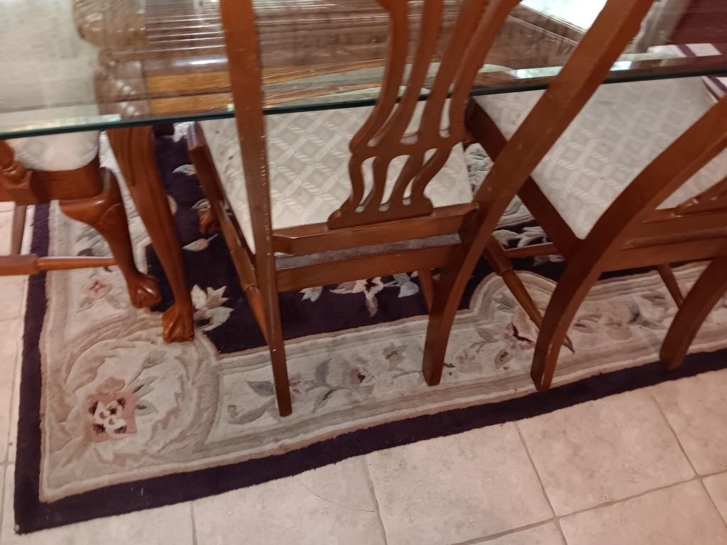 Rug under dining table 91 by 58 needs cleaning