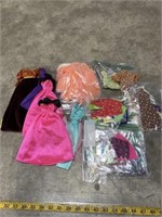 Approximately 20 Barbie doll outfits