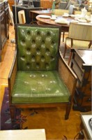 Pair of green tufted leather armchairs