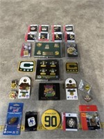 Assortment of Green Bay Packers pins, captains