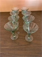 8 light green martini glasses - one slightly