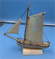 Ivory sail boat by Arnie Iyakitan with ivory sails