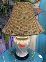 Decorative lamp with rattan shade.