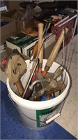 5 gallon bucket of tools including a hatchet