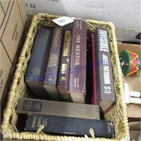 Assorted books in rope-woven basket, 10 x 14 x 7"