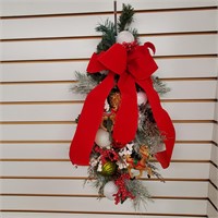 Christmas wreath, measures 24" tall x 11" wide.