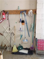 Wall of mops, tarps, broom and more