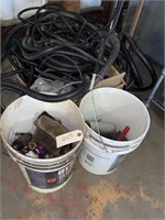 Box with black hoses, to call buckets with