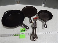 Lodge cast iron skillets and griddle and a hand mi