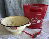 Coca Cola colander, plastic bucket and sunglasses