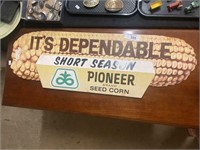 Vintage cardboard Pioneer brand corn sign.