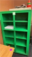 GREEN CABINET OPEN FOR STORAGE