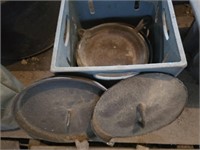 Crate of cast iron skillets