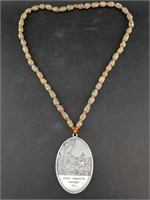 Copy of a late 1700's peace medal on strand with H