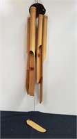 Large bamboo wind chime is broken at the top