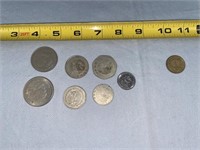 7 Mexican Coins and a 1 Franc Coin