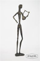 Stylized Metal Statue of Man With Lyre