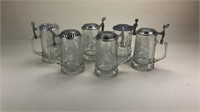 Glass Steins with pewter top.