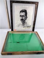 Framed charcoal portrait drawn in 1927 and a