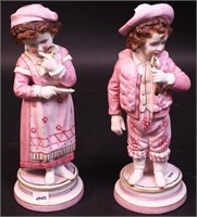 A pair of bisque figurines of little
